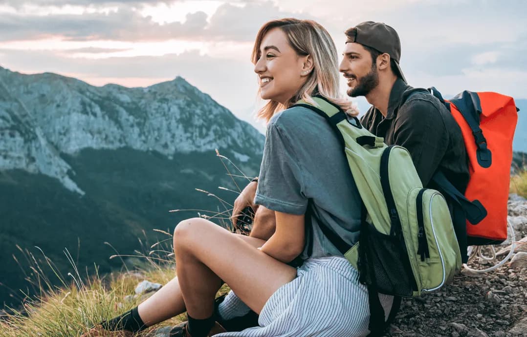 Two smiling backpackers