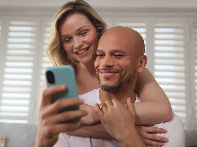 Couple looking at a phone together