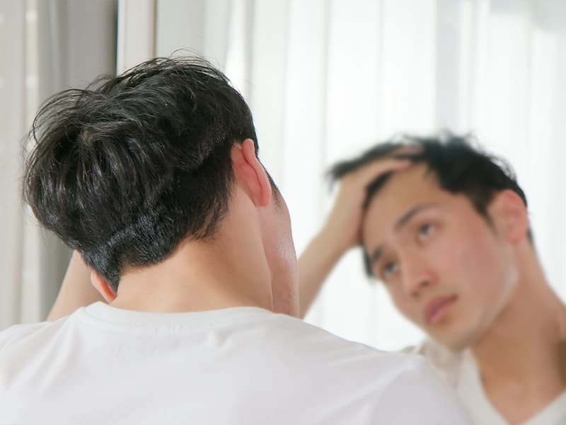 A man looking in the mirror