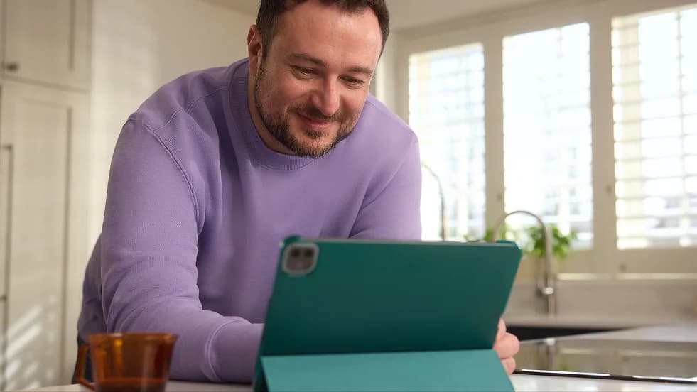 Photo of a man using a tablet