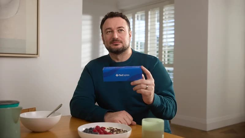 Man holding his MedExpress package
