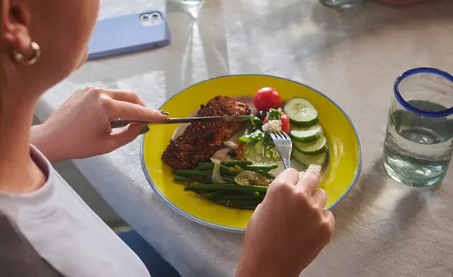 A woman eating a healthy meal